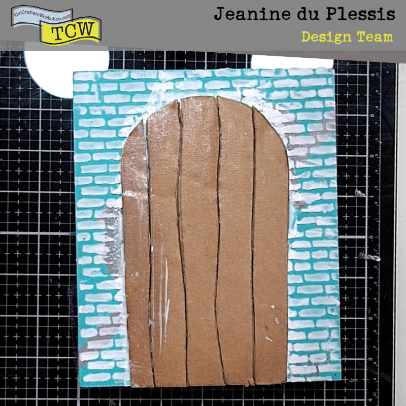 Cut out door stuck to brick pattern canvas.