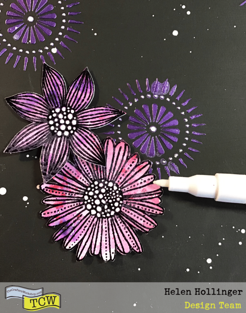 Using a white paint pen, doodle around the flower bursts and the inside of the stamped images. 