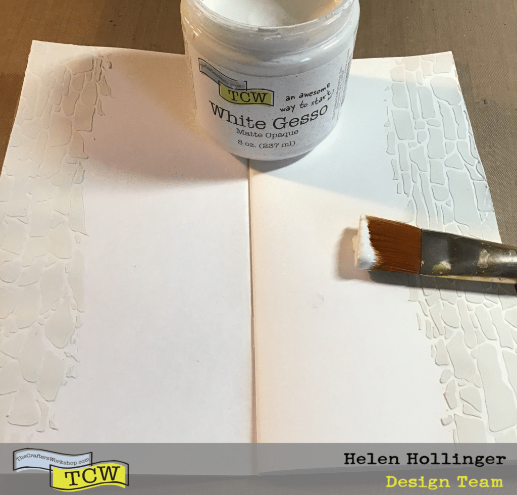 Using a brush, apply a layer of TCW9001 White Gesso over both pages.