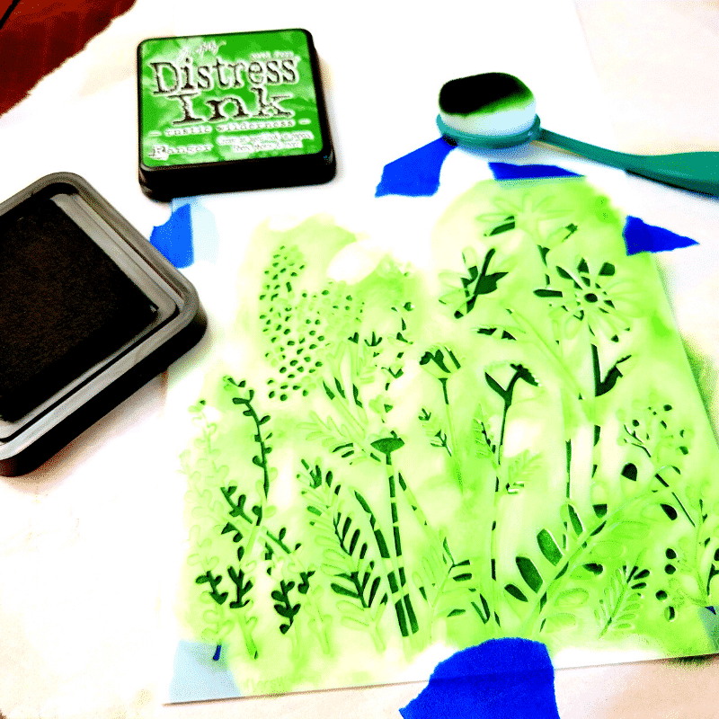 The stacked stencils have been inked using an ink brush and Rustic Wilderness Distress Ink.